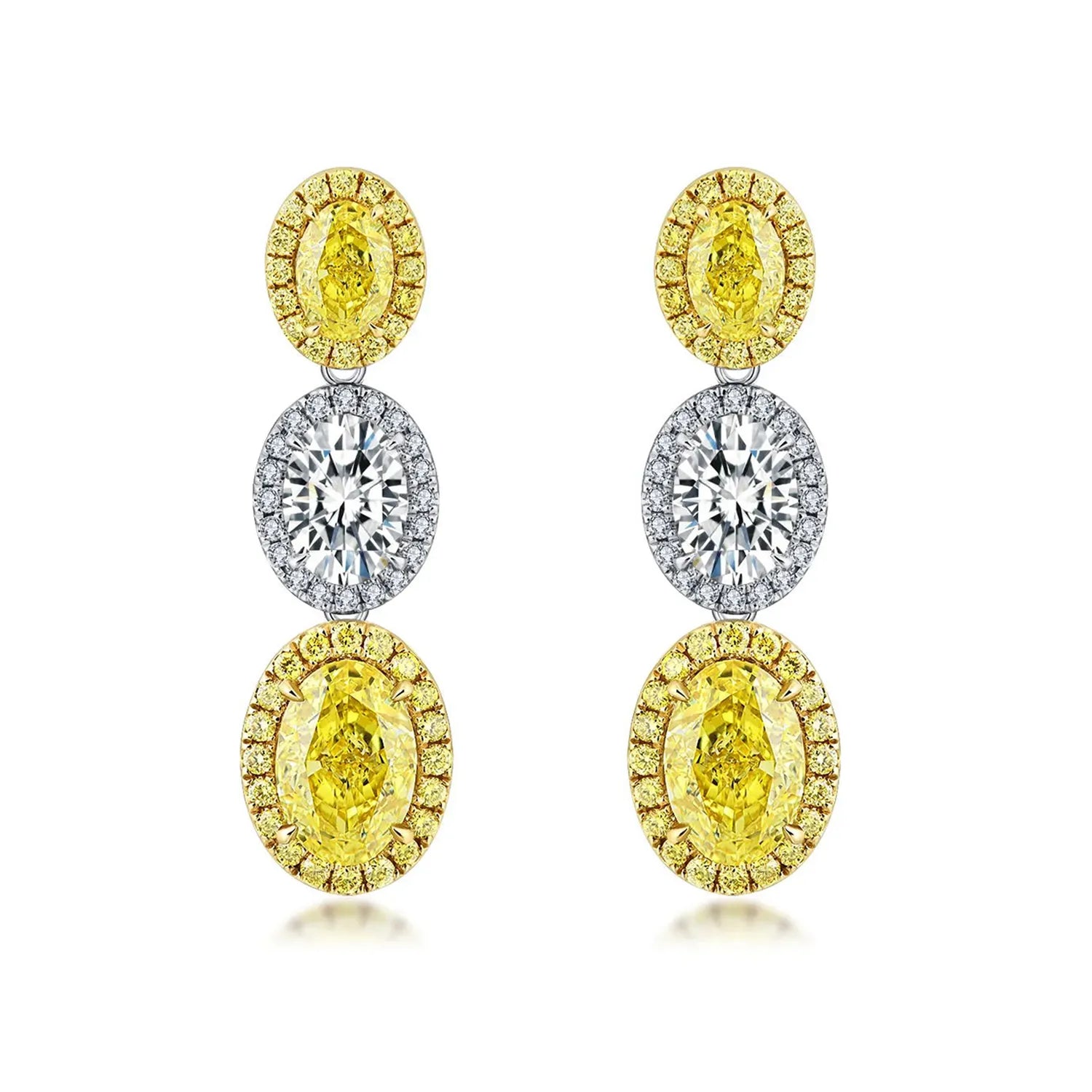 4.4 Carat Oval Cut Halo Three Stone Fancy Yellow Lab Grown Diamond Drop Earrings.
