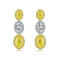 4.4 Carat Oval Cut Halo Three Stone Fancy Yellow Lab Grown Diamond Drop Earrings.