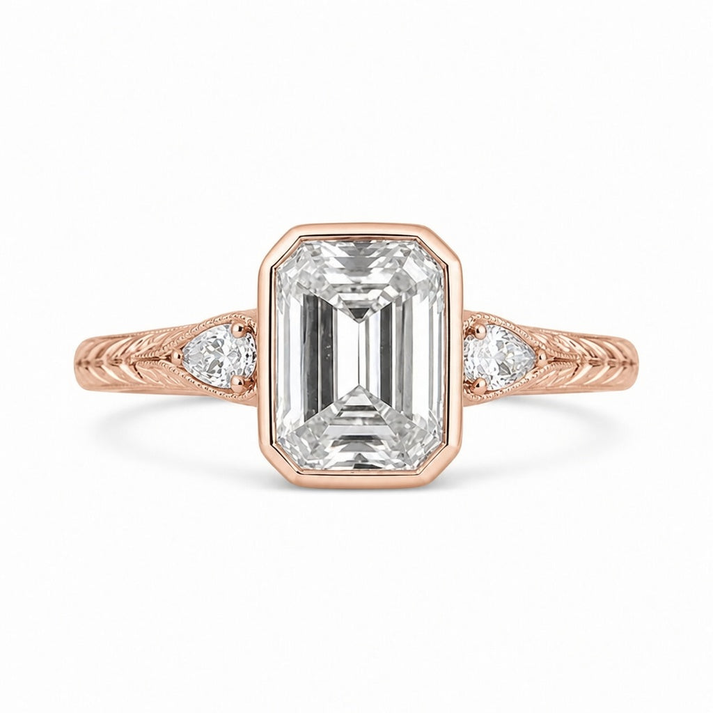 4.00 CT Emerald Cut Lab-Grown Diamond Three-Stone Engagement Ring in 14K White Gold – Pear Side Stone Bezel Trilogy Design