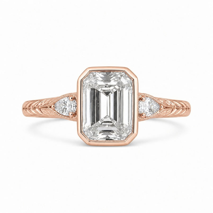 4.00 CT Emerald Cut Lab-Grown Diamond Three-Stone Engagement Ring in 14K White Gold – Pear Side Stone Bezel Trilogy Design
