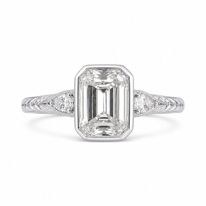 4.00 CT Emerald Cut Lab-Grown Diamond Three-Stone Engagement Ring in 14K White Gold â€“ Pear Side Stone Bezel Trilogy Design from Diamond Studio