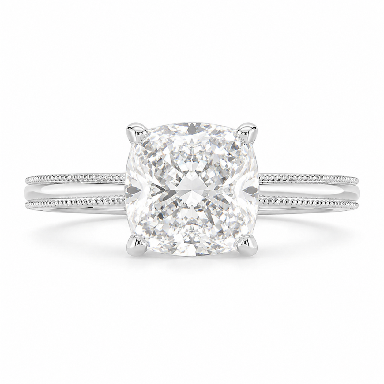 A radiant cut diamond engagement ring in a four-prong setting on a polished silver-colored band with a subtle milgrain pattern, shown against a plain white background.