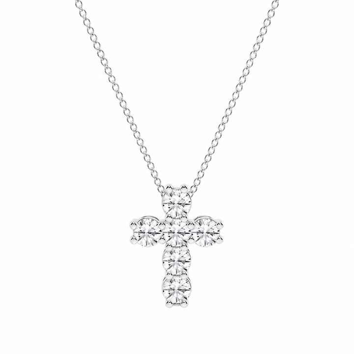 Silver cross pendant necklace on a white background