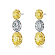 4.4 Carat Oval Cut Halo Three Stone Fancy Yellow Lab Grown Diamond Drop Earrings.