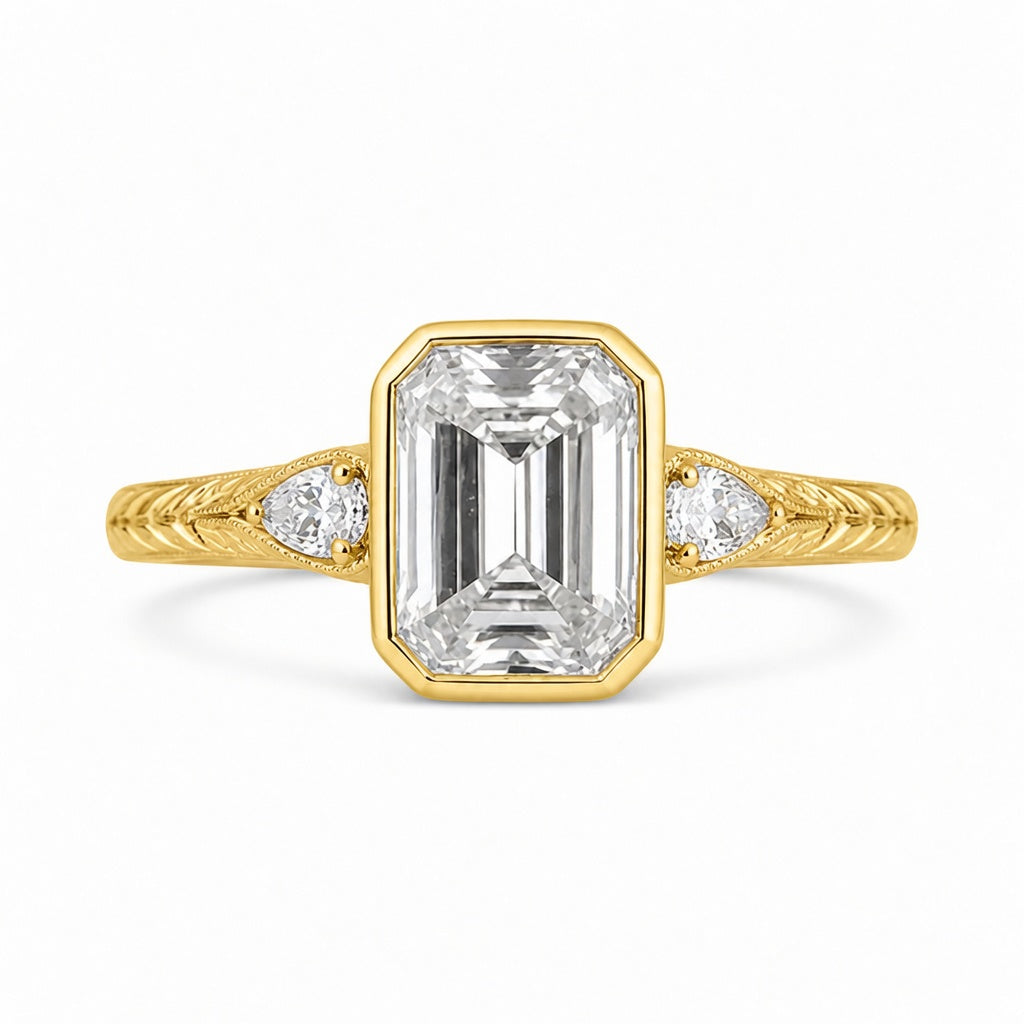 4.00 CT Emerald Cut Lab-Grown Diamond Three-Stone Engagement Ring in 14K White Gold – Pear Side Stone Bezel Trilogy Design
